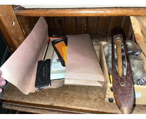 A boxed microscope, flying shuttle, a textile gauge, swatches of cloth, various other gauges, leaflets of textile engineering