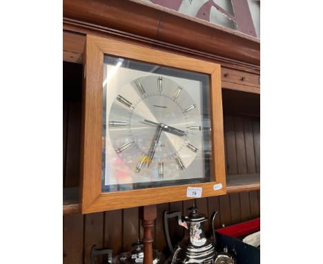 A retro wood cased Toshiba Quartz wall clock 