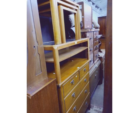 A vintage chest of drawers, a glass top coffee table and a similar nest of tables. 