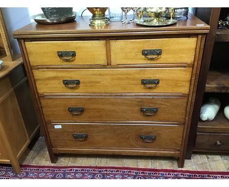 A late 19th century Gothic Revival mahogany chest, of two short and three long graduated drawers with chamfered edges and pan
