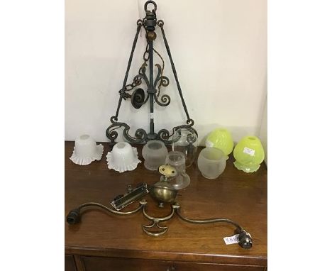 A mixed lot of lighting shades including a pair of vaseline style green shades, together with a hanging wrought iron fitting,