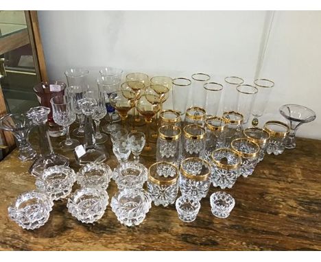 A mixed lot of mainly vintage stemmed glasses and beakers etc. together with vases, candlesticks, etc. (a lot)