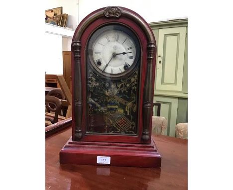 A rare American wooden dome top mantle clock with with unusual red painted case, the white painted dial flanked by moulded co