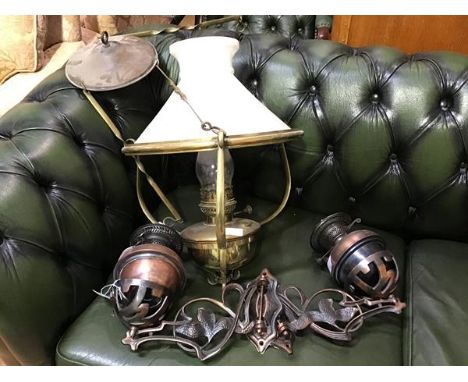 An early 19thc brass hanging station style paraffin lamp with milk glass coolie style shade and clear glass funnel together w