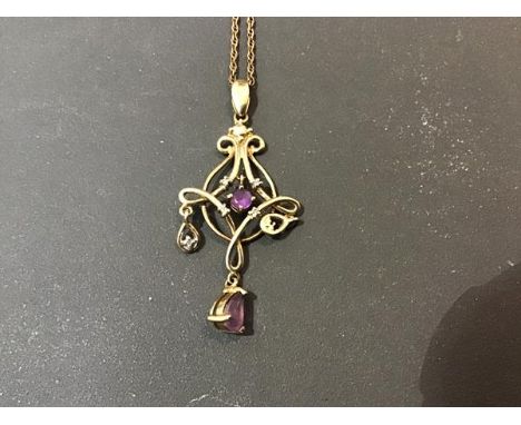 A 9ct gold amethyst set lady's pendant on a yellow metal chain marked 925 (3.4g)