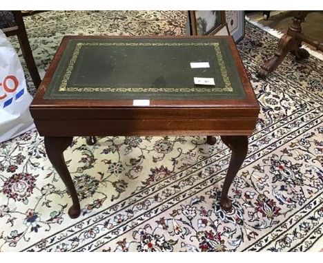 A mahogany cutlery canteen in the form of a coffee table in the 19thc style with leather inset skiver, with hinged lid enclos