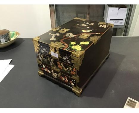 A Chinese travelling mahogany jewellery box with brass fittings, with floral painted decoration, the folding top with dressin