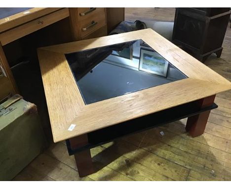 A modern oak and painted low table, the glass top above a central velvet-lined recess, on square section legs (43 x 100 x 100