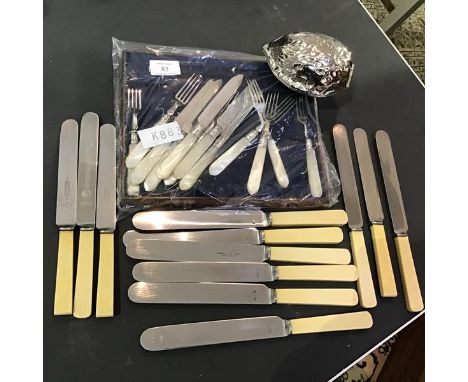 A mixed lot consisting of a set of six mother of pearl handled Sheffield plate fruit knives and forks together with twelve st