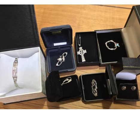 A mixed lot of silver jewellery including a Celtic cross, brooches, Mackintosh style earrings and bracelet etc. (a lot)