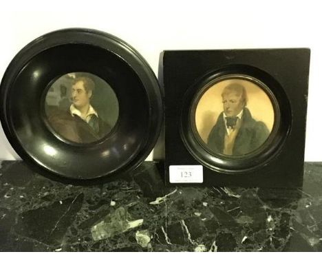 Two ebonised portrait prints, one of Sir Walter Scott, the other Byron