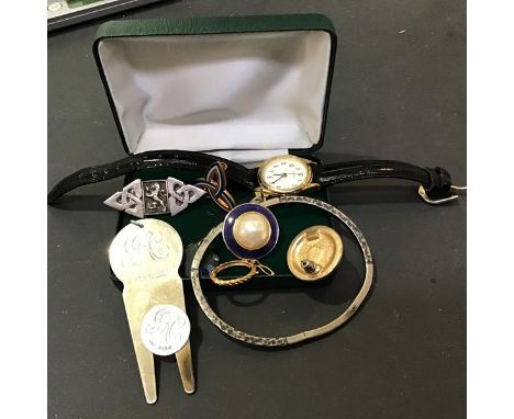 A mixed lot including a silver two piece money clip, a Scottish silver brooch, a bangle, watch etc. (a lot)
