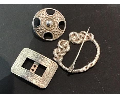 A mixed lot of Scottish silver jewellery including a circular Celtic brooch, hallmarked Iona,  a white metal pennanular brooc