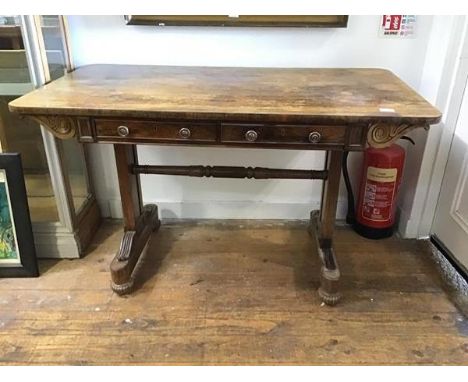 A Scottish Regency rosewood sofa table c.1820, in the manner of William Trotter, the rectangular top above a pair of mahogany