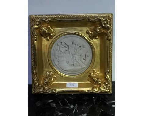 A gilt frame enclosing a moulded circular panel of Athenian Lovers (external: 27cm x 27cm)
