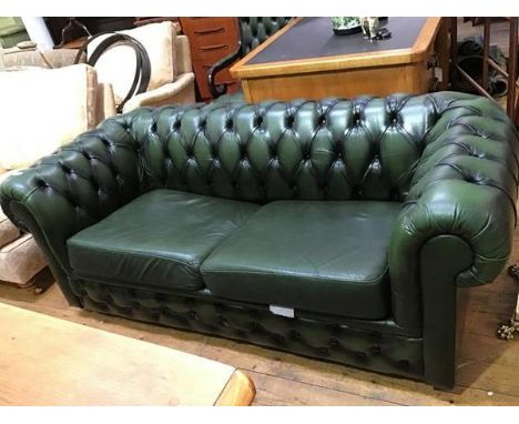 A modern leather Chesterfield sofa bed, with button upholstery (69 x 185 x 88cm)