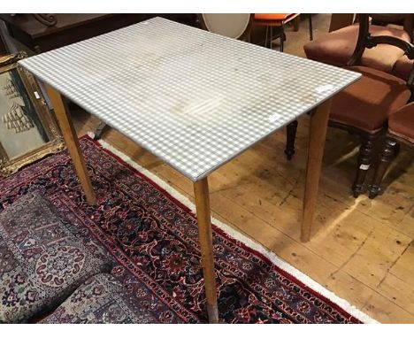Carl Jacobs for Kandya, A 1950s beech and formica kitchen table, the chequer top with metal lining raised on 4 detachable leg