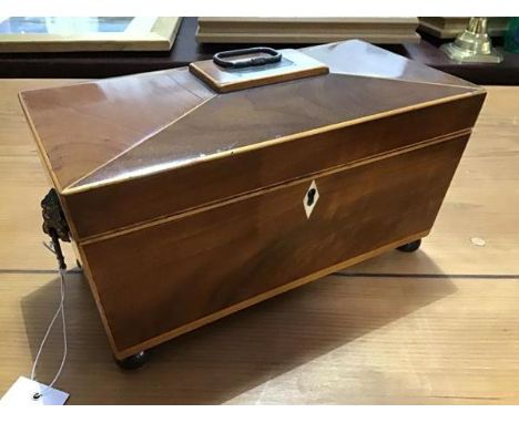 A 19thc mahogany and satinwood banded sarcophagus shaped tea caddy, the hinged top with brass handle, with fitted interior an