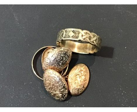 A pair of gentleman's yellow metal engraved oval sleevelinks together with a 9ct gold wedding band and a Celtic style 9ct gol
