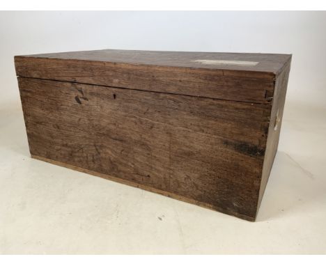 A large teak travelling trunk with original labels. W:82cm x D:52cm x H:38cm