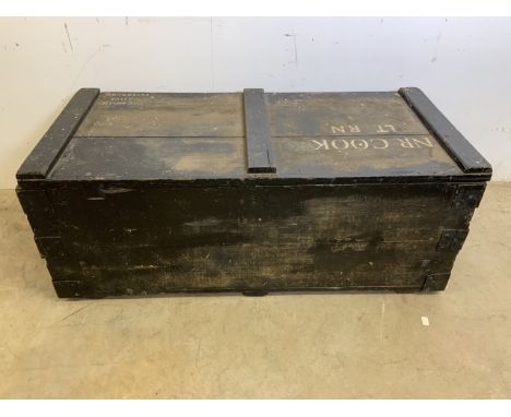 A black painted wooden trunk with hand painted lettering NR COOK LT RN. W:102cm x D:48cm x H:41cm