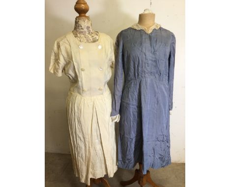 A vintage blue maids dress with embellished collar and cuffs together with a 1930s button yoke dress 