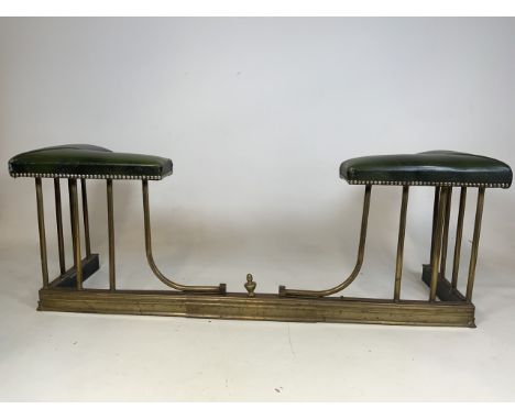 An adjustable early 20th century fire fender with green leather top H:48cm