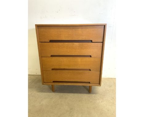 A Stag mid century chest of four drawers oink light teak. 