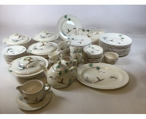 A large quantity of Royal Doulton Coppice . Including four lidded tureen dishes, dinner plates, breakfast plates, tea plates,