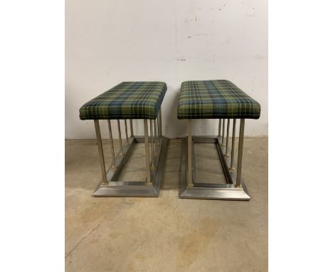 A pair of upholstered fender style benches with metal bases. W:45cm x D:94cm x H:56cm