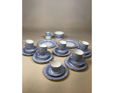 An early 20th century art nouveau style blue and white tea set Stella made for Oetzman &amp; Co London. With two cake plates,