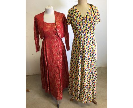 A mid century evening dress - a red and gold ( metal thread) button fronted dress with bolero jacket - zip detail to sleeves 