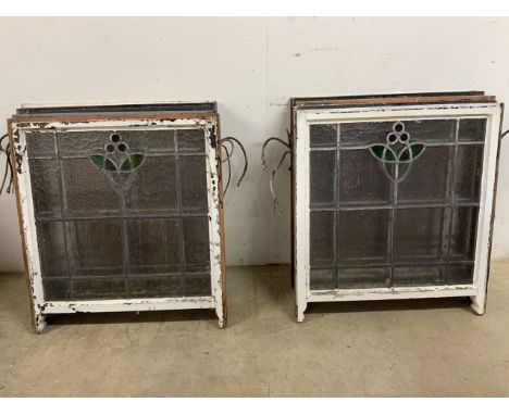 Eight stained glass early 20th century sash windows with reinforcement bar, with original handles.Furthest point. W:71.5cm x 
