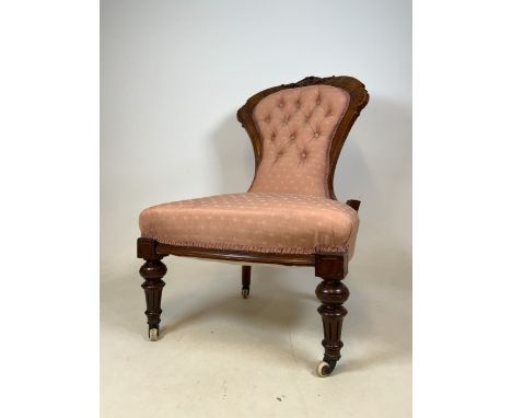 A Victorian button back mahogany bedroom chair with brass and ceramic castorsSeat height H:40cm