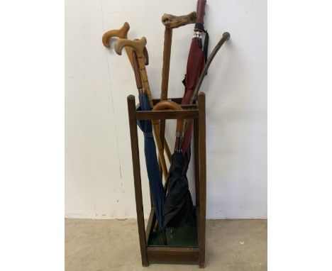 A stick stand with sticks and umbrellas.H:68cm