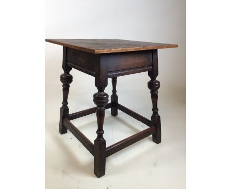 An oak lamp table with square top and cupped bannister legs - label to base G Hardy and co W:43cm x D:43cm x H:49cm