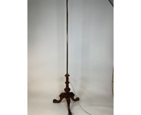 A converted standard lamp with tripod base with adjustable brass and copper top. W:45cm x D:45cm x H:176cm