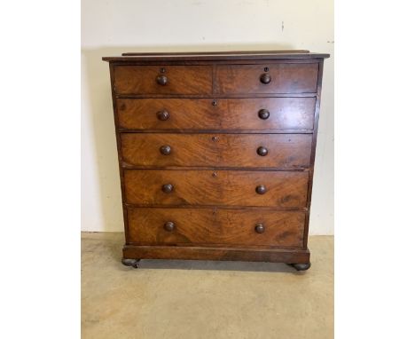 A large Victorian mahogany caddy top chest of drawers with turned handles on separate base with bun feet and ceramic castors.