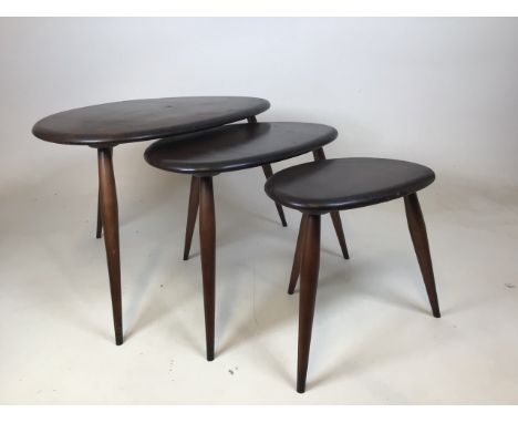 A set of mid century Ercol Pebble tables W:64cm x D:45cm x H:41cm Dimensions of largest table