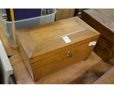 A sarcophagus shaped tea caddy.