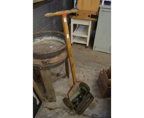 An old manual operated lawn mower.