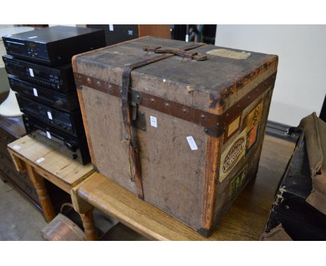 Moynat, Paris, a metal and leather bound canvas travelling trunk with internal lift out tray, paper label to the interior of 