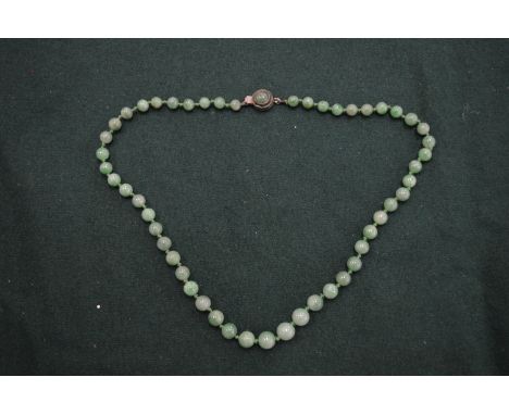 A jade bead necklace.