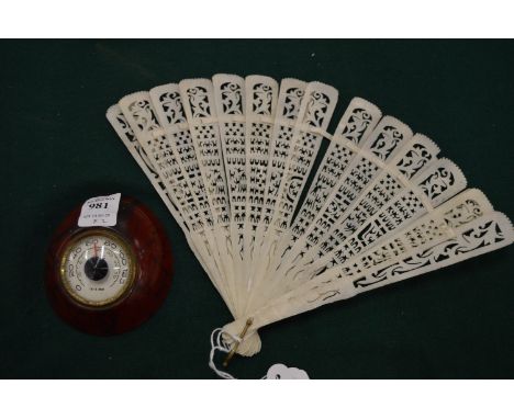 A fan and a desk thermometer.