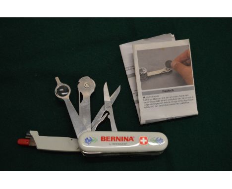 A Swiss Army style sewing knife.