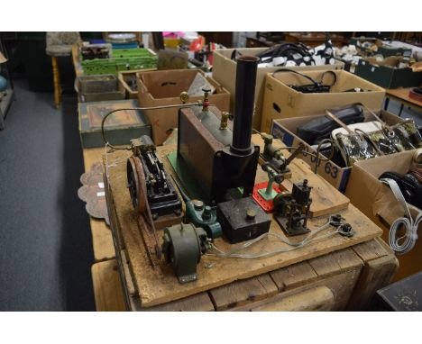 A Stuart stationary engine with spirit burner and accessories.