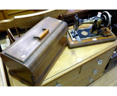 A vintage Jones manual sewing machine.