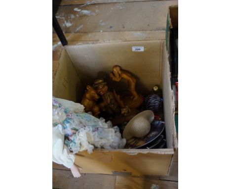 A mixed lot of assorted items to include a bisque doll, collectors plates, assorted miniatures.