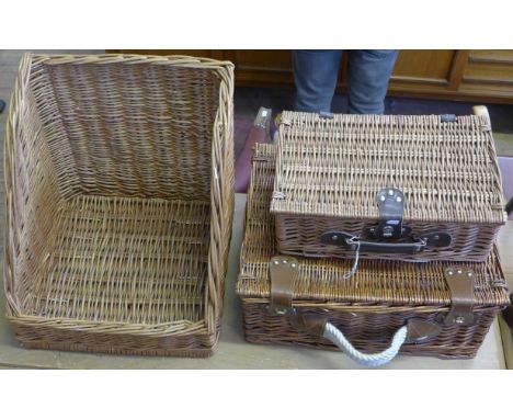 Three various wicker baskets to include a picnic hamper.
