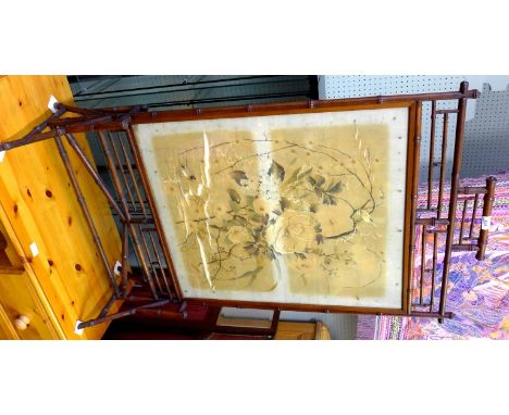 An Aesthetic period faux bamboo fire screen in the Japanesque taste incorporating a damaged Japanese silk work panel.
